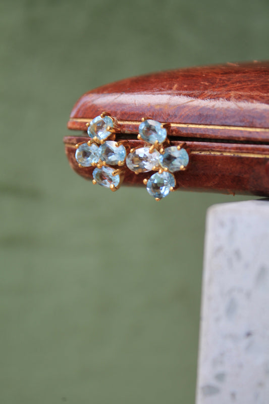 Aros metal plata 925, enchape de oro y topacios azules