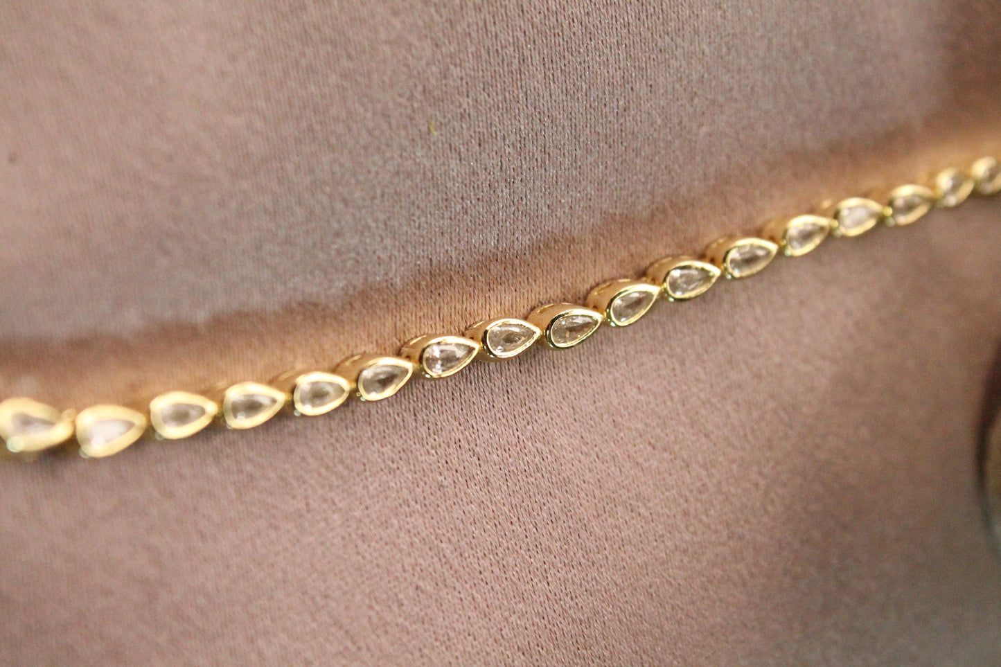 Pulsera tennis gota, plata 925 con enchape en oro y zirconitas.